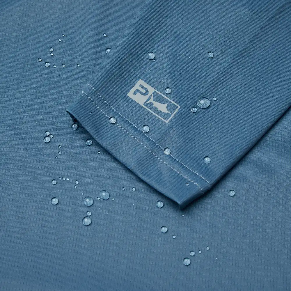 1015243010-PET PLAYERA CON CAPUCHA EXO-TECH DE MANGA LARGA – COLOR PETROL – TALLA GRANDE – PELAGIC - Imagen 5